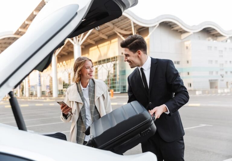 Driver greeting travelers at Nassau airport for private airport transfer Bahamas with luggage assistance and luxury vehicle